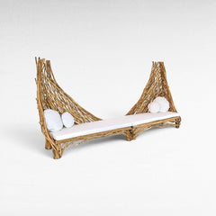 Chora Barefoot Luxury Living garden sofa with natural twig frame, white cushions, and unique sculptural backrest design.