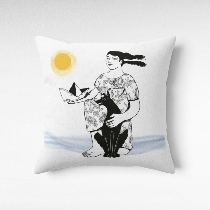 Chora Barefoot Luxury Living square throw pillow featuring a whimsical illustration of a woman, cat, and sun.