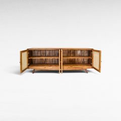 Chora Barefoot Luxury Living Viennesse rattan buffet cabinet with open doors showing internal wooden shelving.