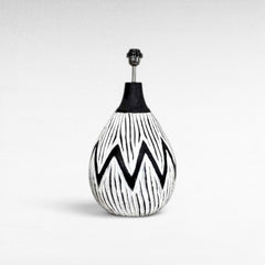 Chora Barefoot Luxury Living white and black wood table lamp with a zigzag pattern and a black neck.