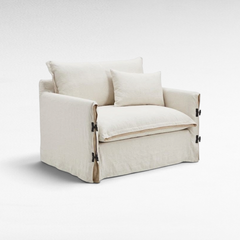 Chora Barefoot Luxury Living white linen two-seater sofa with side tie-up detailing and plush cushions