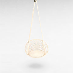 Chora Barefoot Luxury Living white macrame rope hammock swing with a circular woven seat pad for indoor relaxation.