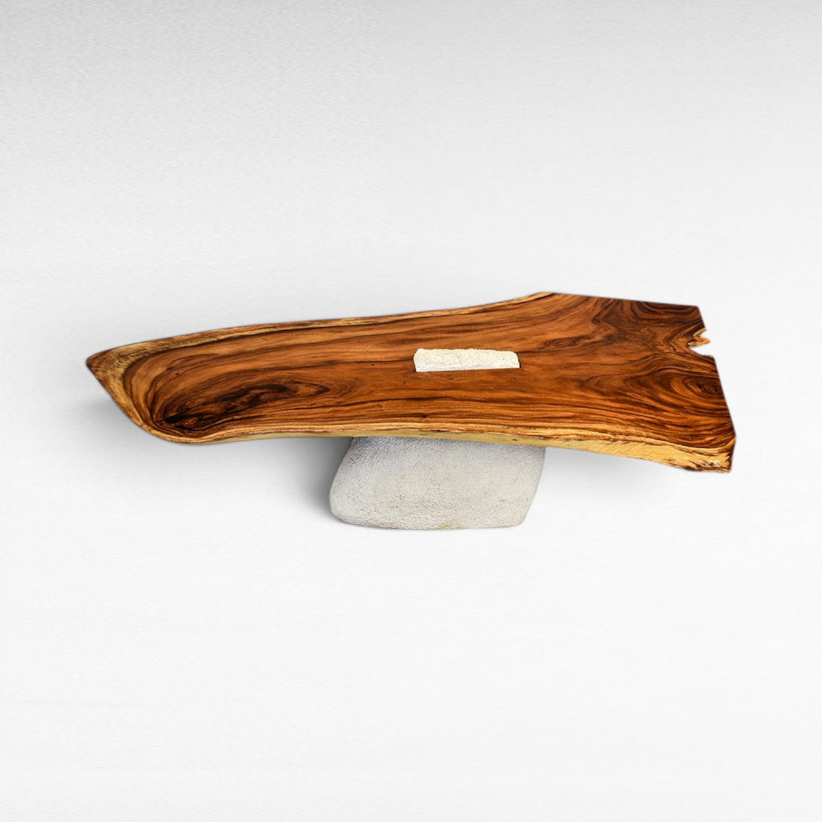 Chora Barefoot Luxury Living natural wood dining table with a terrazzo inlay, supported by a textured stone base.