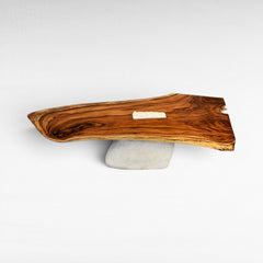Chora Barefoot Luxury Living natural wood dining table with a terrazzo inlay, supported by a textured stone base.