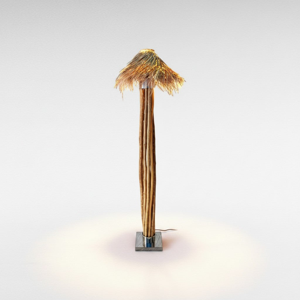 Chora Barefoot Luxury Living floor lamp with natural wood branches, stainless steel base, and woven raffia shade.