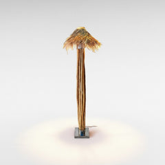 Chora Barefoot Luxury Living floor lamp with natural wood branches, stainless steel base, and woven raffia shade.