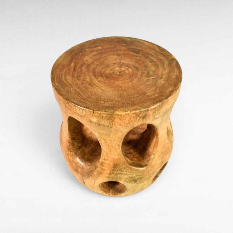 Chora Barefoot Luxury Living natural wood side table with carved holes and curved design, 45cm height.