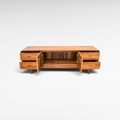 Chora Barefoot Luxury Living wooden buffet with open doors and drawers, featuring a natural grain finish.