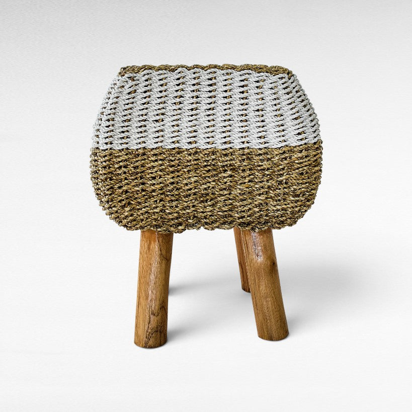 Chora Barefoot Luxury Living stool with a woven natural grass and white rope seat on three sturdy wooden legs.