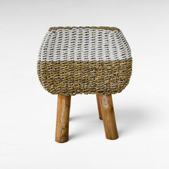 Chora Barefoot Luxury Living stool with a woven natural grass and white rope seat on three sturdy wooden legs.