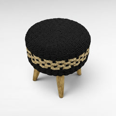 Chora Barefoot Luxury Living round woven stool with white and natural braided rattan seat and wood legs.