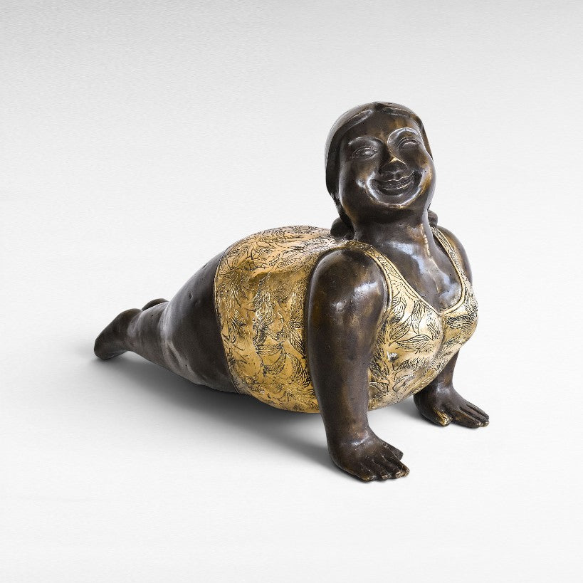 Chora Barefoot Luxury Living bronze and gold yoga figurine in a playful pose, detailed with floral patterns.