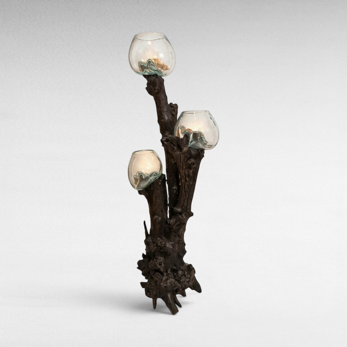Chora Barefoot Luxury Living sculptural floor lamp with three handblown glass shades on a dark teak wood root base.
