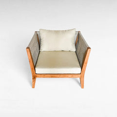 Chora Barefoot Luxury Living armchair with light beige cushions and woven rope sides, featuring a wooden frame.