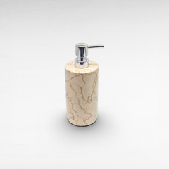 Chora Barefoot Luxury Living beige marble soap dispenser with chrome pump. Cylindrical design.