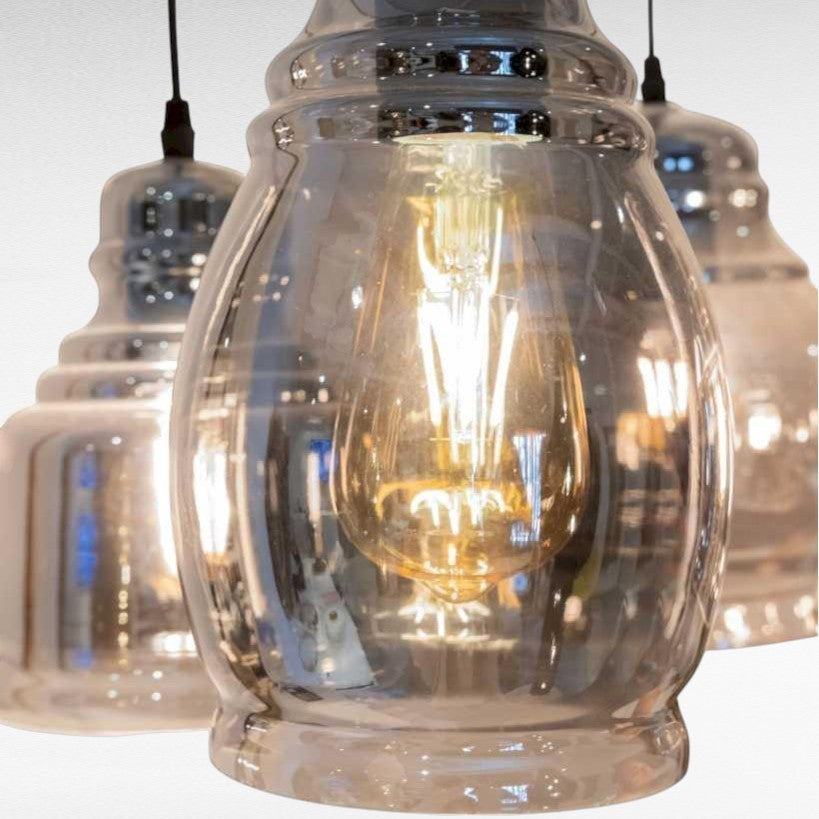Chora Barefoot Luxury Living reflective black metal and glass pendant light with Edison bulb.