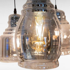 Chora Barefoot Luxury Living reflective black metal and glass pendant light with Edison bulb.