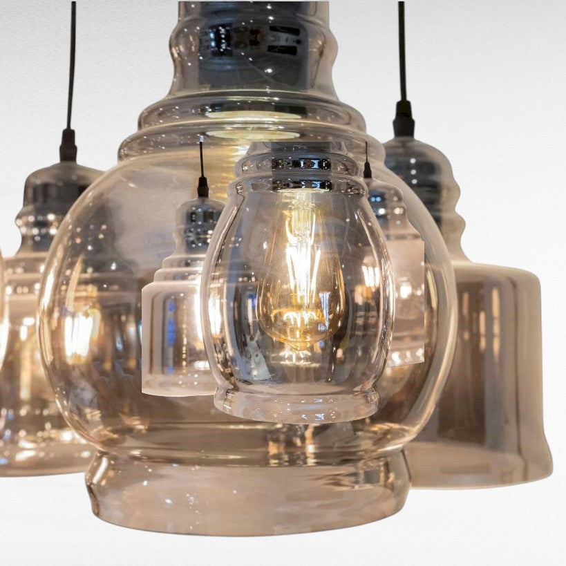 Chora Barefoot Luxury Living reflective black metal and glass pendant light with vintage bulbs.