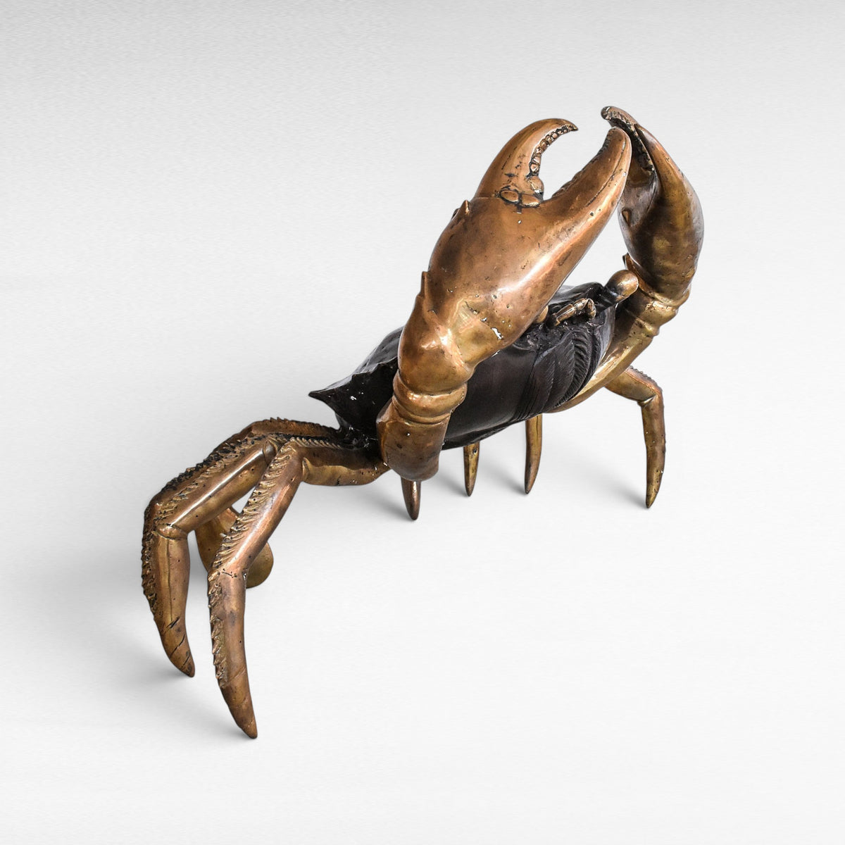 Chora Barefoot Luxury Living oversized bronze crab sculpture with black and gold polished brass claws and legs.