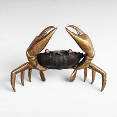 Chora Barefoot Luxury Living oversized bronze crab sculpture with polished brass claws and legs, black and gold finish.