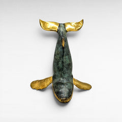 Chora Barefoot Luxury Living medium bronze whale sculpture with verdigris patina and gold accents.