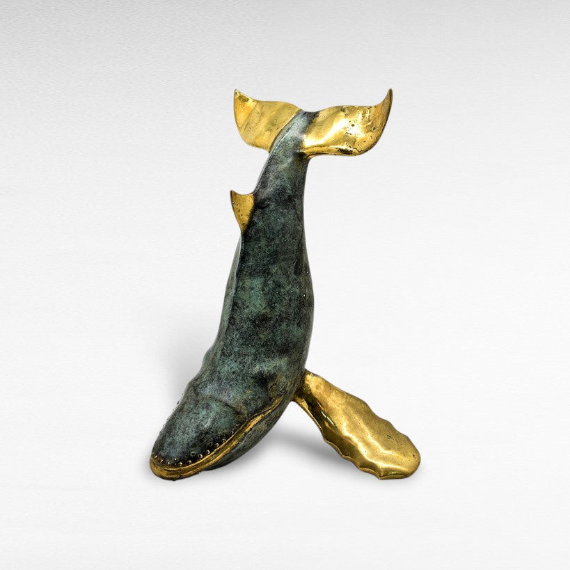 Chora Barefoot Luxury Living bronze whale sculpture with verdigris patina and polished brass tail and fins.