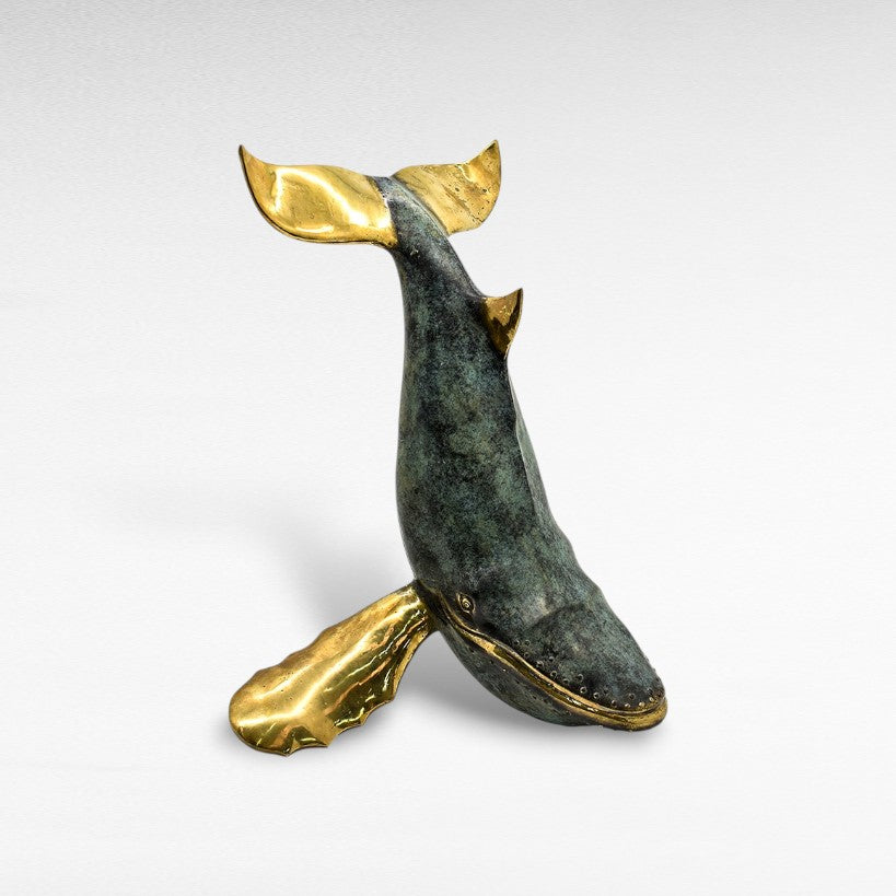 Chora Barefoot Luxury Living bronze whale sculpture with verdigris patina and polished brass accents, depicting a breaching whale.