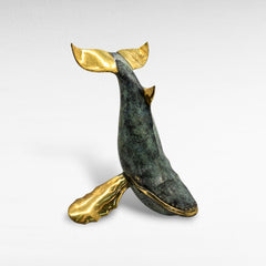 Chora Barefoot Luxury Living bronze whale sculpture with verdigris patina and polished brass accents, depicting a breaching whale.