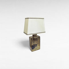Chora Barefoot Luxury Living gold and black tiger print table lamp with cream shade.