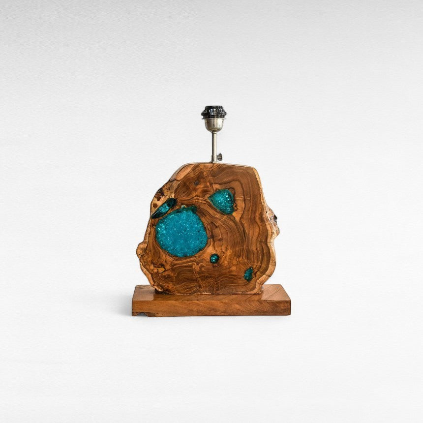 Chora Barefoot Luxury Living teak wood table lamp with natural wood grain and vibrant blue resin inlays.