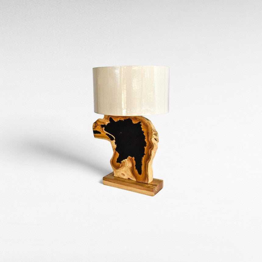 Chora Barefoot Luxury Living teak wood and black resin table lamp with a natural wood grain base and cream shade.