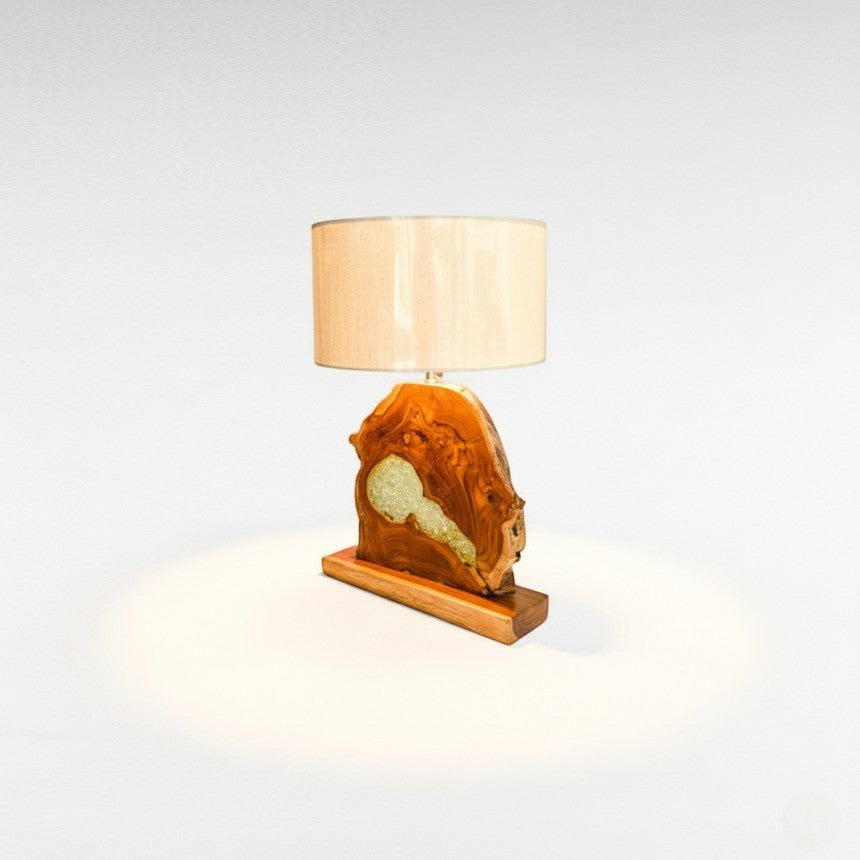 Chora Barefoot Luxury Living teak wood and resin table lamp with natural wood base and beige shade.