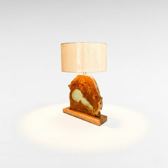 Chora Barefoot Luxury Living teak wood and resin table lamp with natural wood base and beige shade.