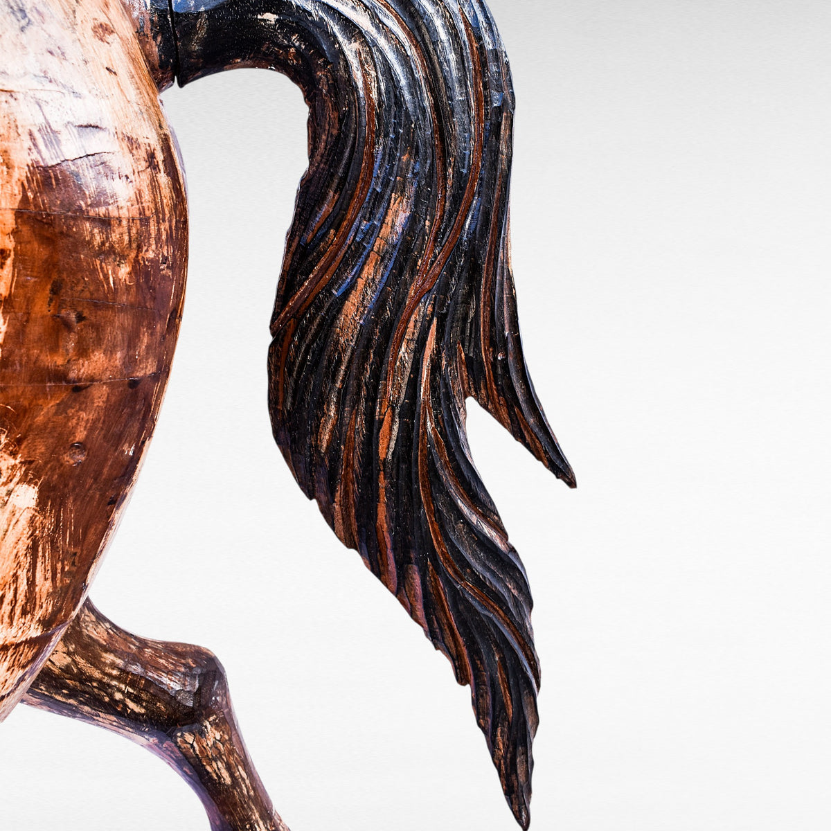 Chora Barefoot Luxury Living natural and black suar wood horse sculpture, detailed carved mane and tail.