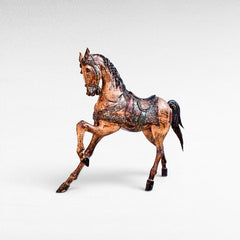 Chora Barefoot Luxury Living natural and black suar wood horse statue with ornate saddle and bridle, detailed wood grain.