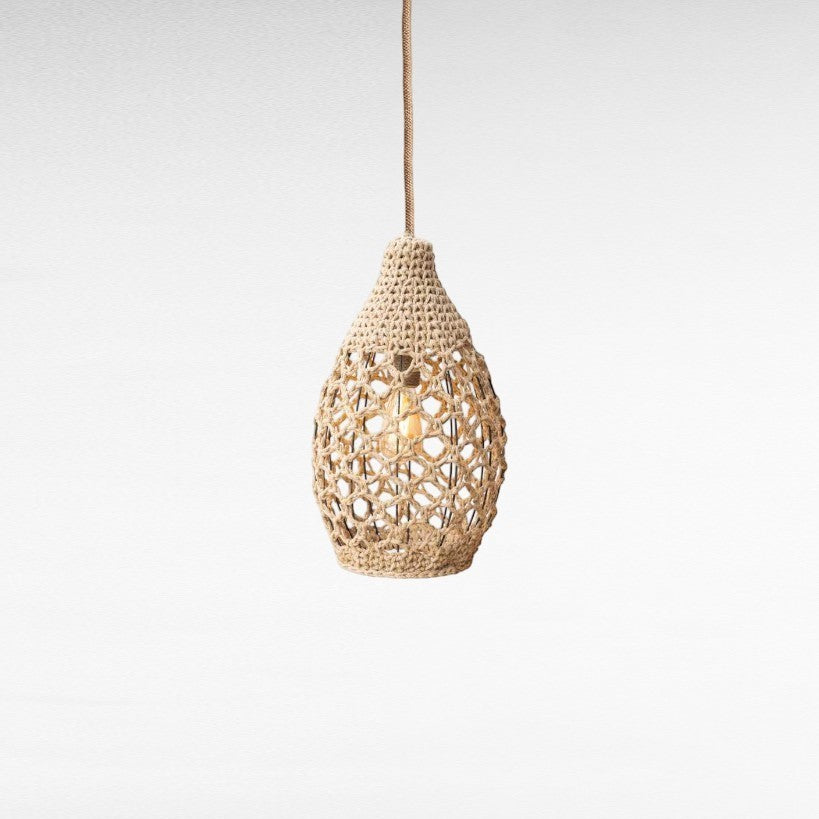 Chora Barefoot Luxury Living off-white handwoven rope pendant light in a drop shape, 38cm high.