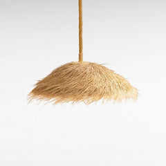 Chora Barefoot Luxury Living natural palm leaf pendant light with a triangle shape and frayed edges, 80cm diameter.