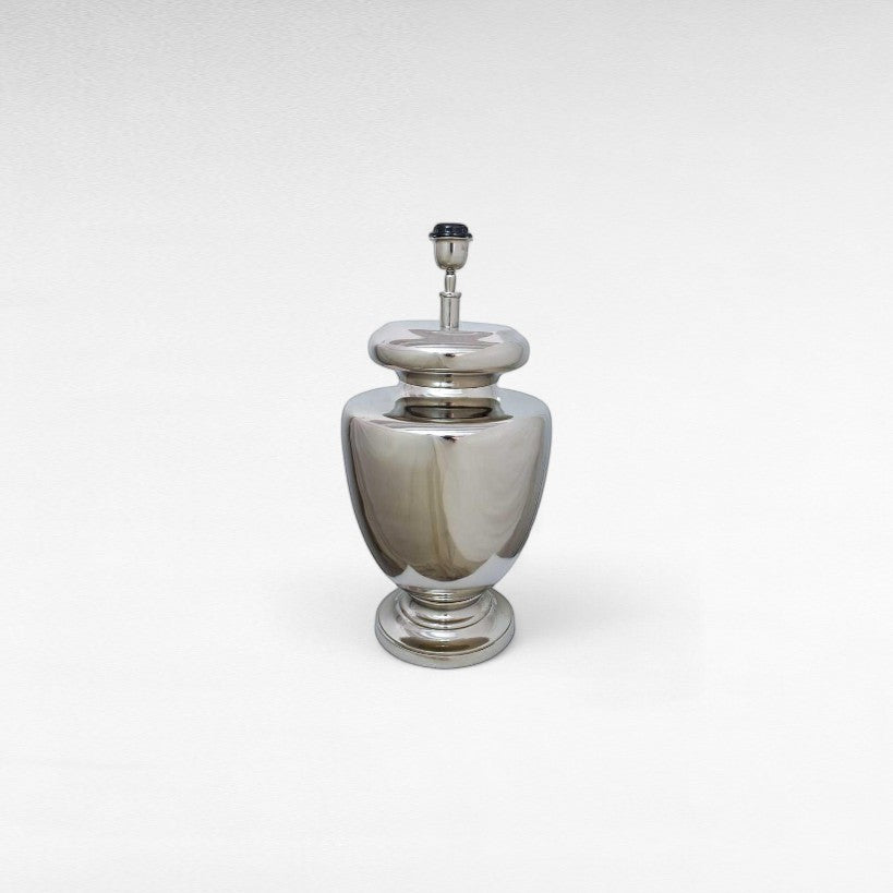 Chora Barefoot Luxury Living silver metal table lamp with a polished finish and urn-shaped base.