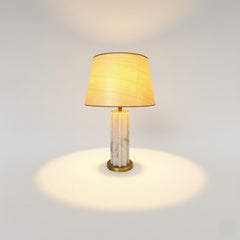 Chora Barefoot Luxury Living white and gold marble metal table lamp with beige shade, ideal for living rooms and bedrooms.