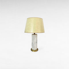 Chora Barefoot Luxury Living white and gold marble metal table lamp with a fluted column base and a textured cream lampshade.