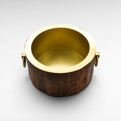 Chora Barefoot Luxury Living large round ice bucket with rustic wood exterior and shiny gold interior and handles.