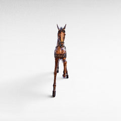 Chora Barefoot Luxury Living natural and black suar wood horse sculpture with intricate saddle detail and rope halter.