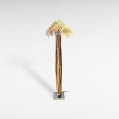 Chora Barefoot Luxury Living floor lamp with natural wood branches, stainless steel base, and woven raffia shade. Tall, natural-inspired design.
