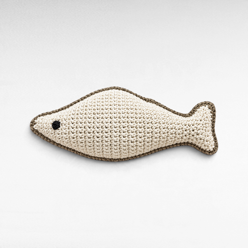 Chora Barefoot Luxury Living off-white crochet fish pillow with a black eye and dark grey trim
